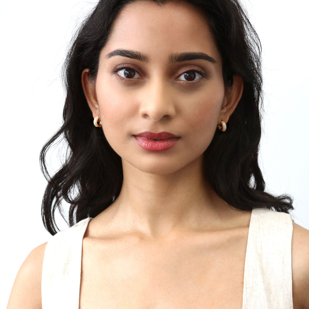 Model wearing Dome CZ Mini Cartilage Huggie Earrings in Sterling Silver 0.5 inch, Yellow Gold Flashed