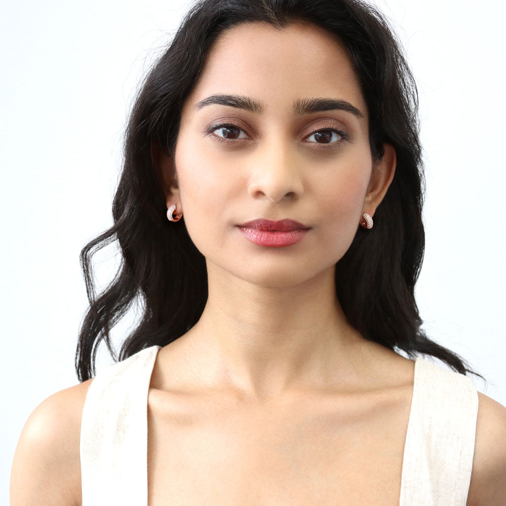 Model wearing Dome CZ Mini Cartilage Huggie Earrings in Sterling Silver 0.5 inch, Rose Gold Flashed