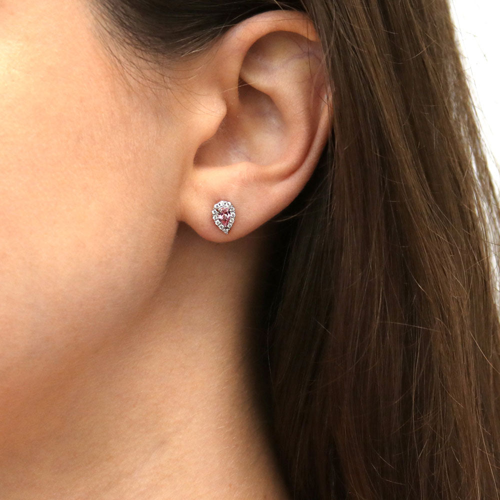 Model wearing Halo Pear CZ Stud Earrings in Sterling Silver, Morganite Color