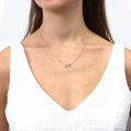 Model wearing Infinity CZ Pendant Necklace in Sterling Silver, Rose Gold Flashed