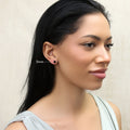 Model wearing Solitaire Black CZ Stud Earrings in Sterling Silver, 5mm