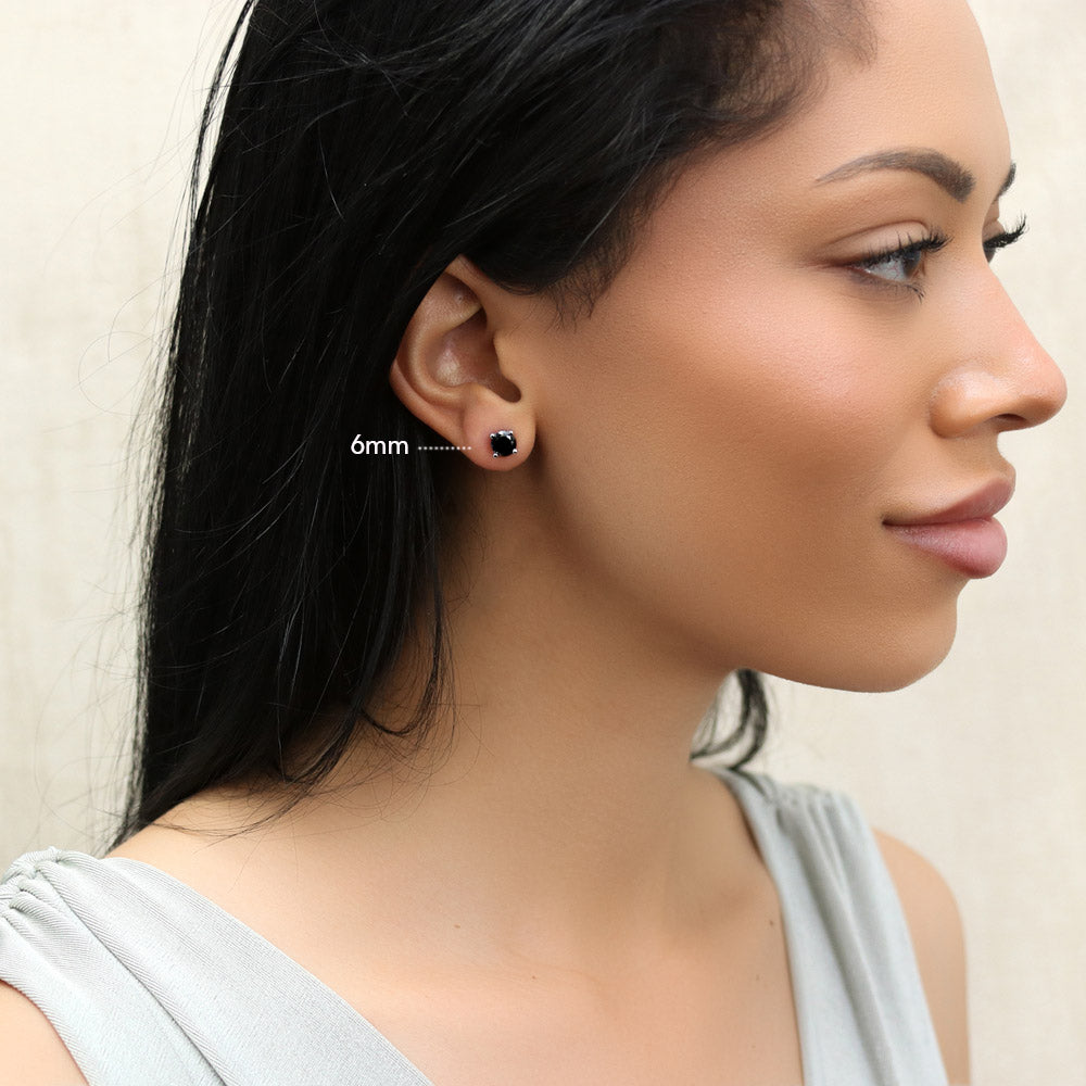 Model wearing Solitaire Black CZ Stud Earrings in Sterling Silver, 6mm