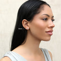 Model wearing Solitaire Bezel CZ Stud Earrings in Gold Flashed Sterling Silver, 4mm