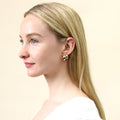 Model wearing Dome Small Hoop Earrings in Sterling Silver 0.8 inch, Yellow Gold Flashed