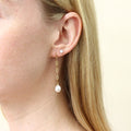 Model wearing Solitaire CZ Stud Earrings in Gold Flashed Sterling Silver, 4mm