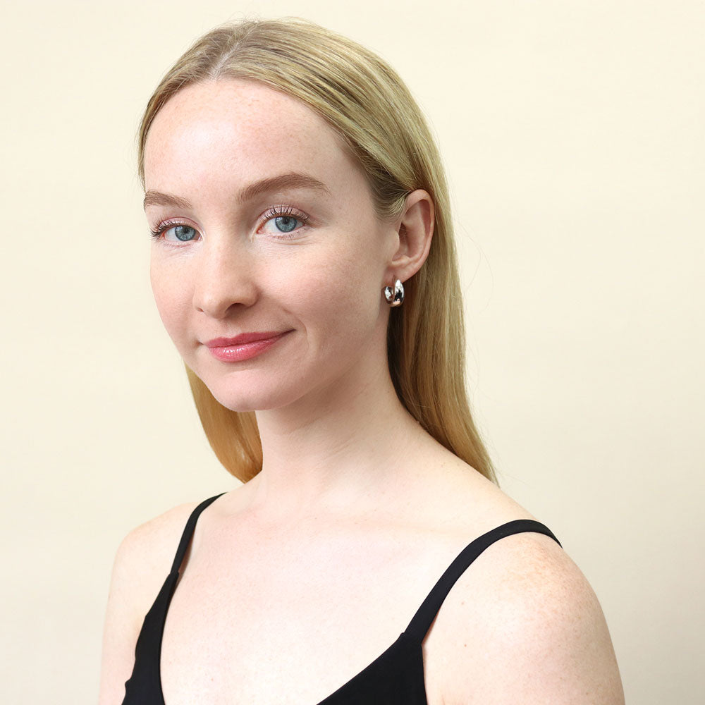 Model wearing Dome Small Hoop Earrings in Sterling Silver 0.8 inch, Rhodium Plated