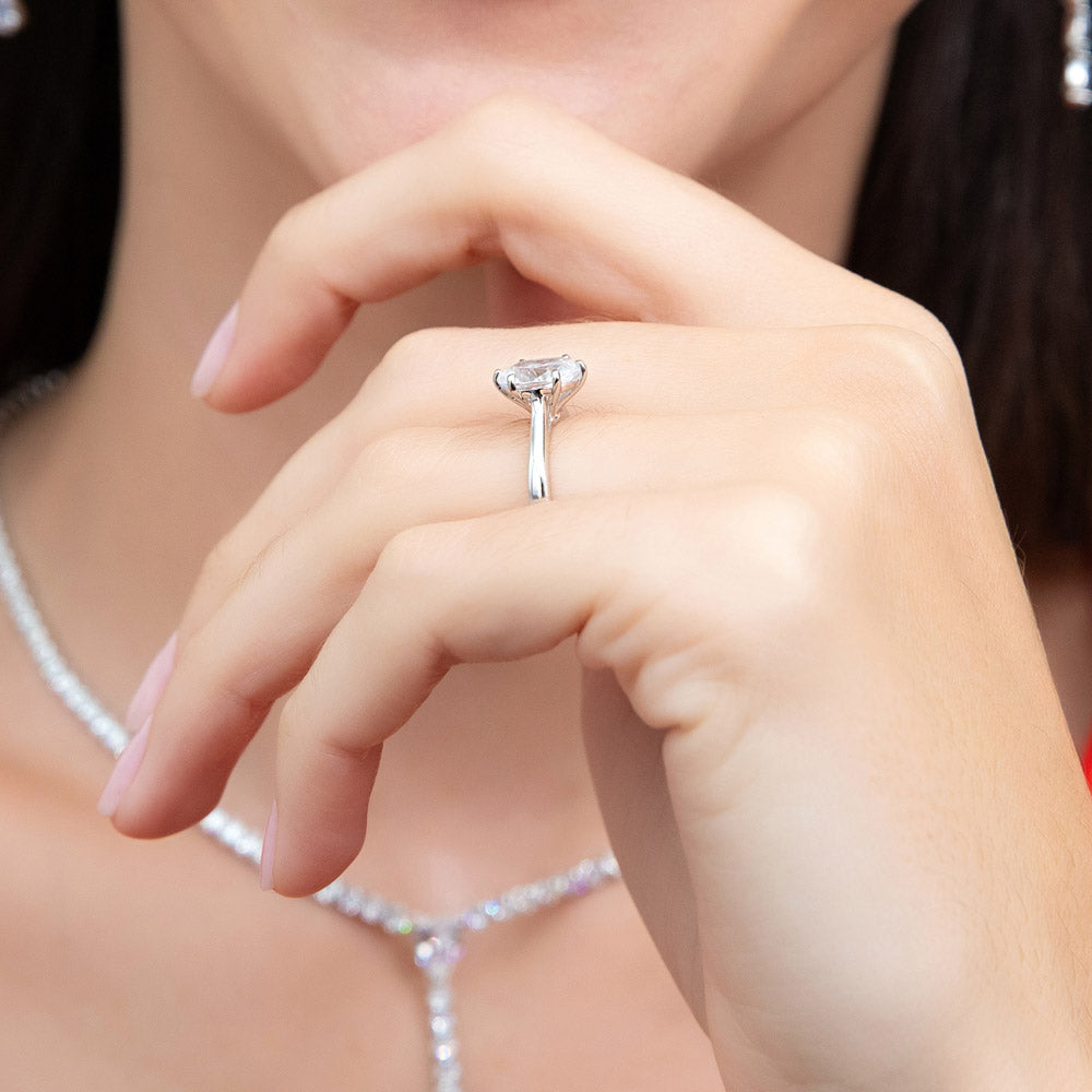 Model wearing Solitaire 1.8ct Oval CZ Ring in Sterling Silver, 6 of 8