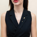 Model wearing Skull Bones Pin in Sterling Silver, Yellow Gold Flashed