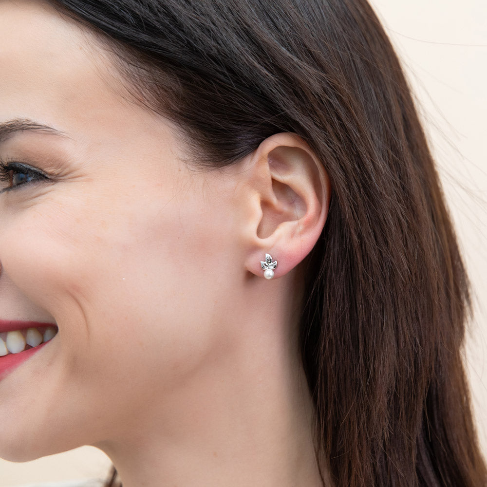 Model wearing Leaf Imitation Pearl Stud Earrings in Sterling Silver, Rhodium Plated