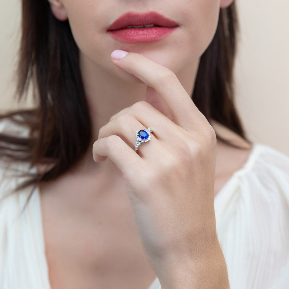 Halo Art Deco Sapphire-Blue Oval CZ Ring in Sterling Silver