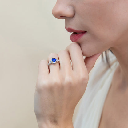 Halo Art Deco Sapphire-Blue Oval CZ Ring in Sterling Silver