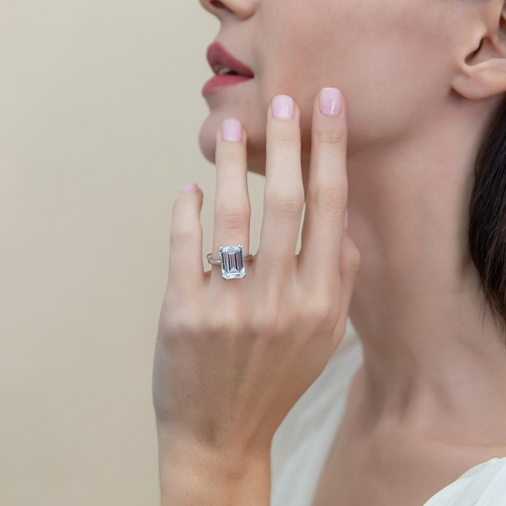 Model wearing Solitaire 8.5ct Emerald Cut CZ Ring in Sterling Silver, 2 of 10