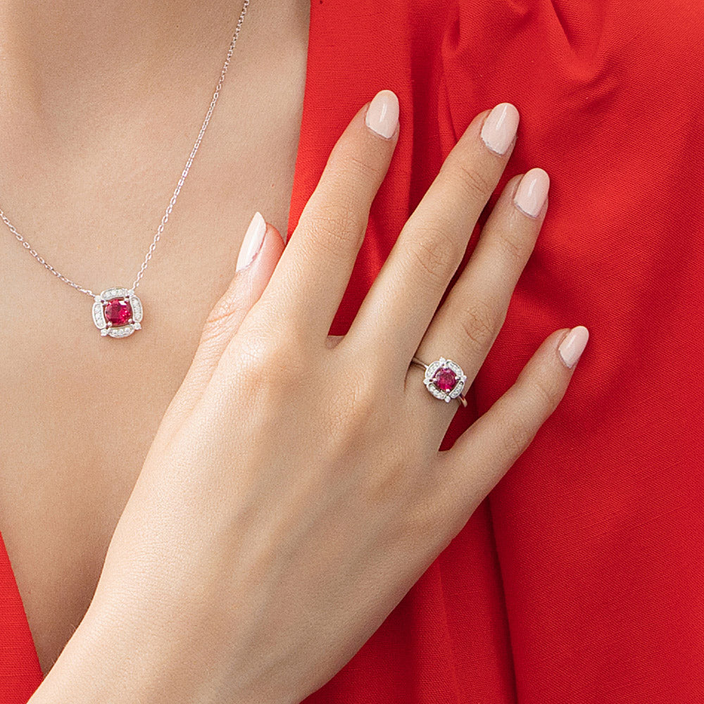 Model wearing Halo Flower Simulated Ruby CZ Ring in Sterling Silver, 3 of 11