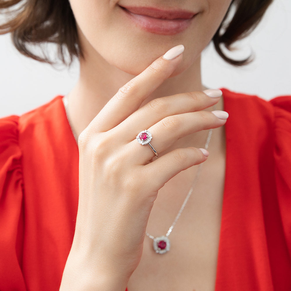 Model wearing Halo Flower Simulated Ruby CZ Ring in Sterling Silver, 2 of 11