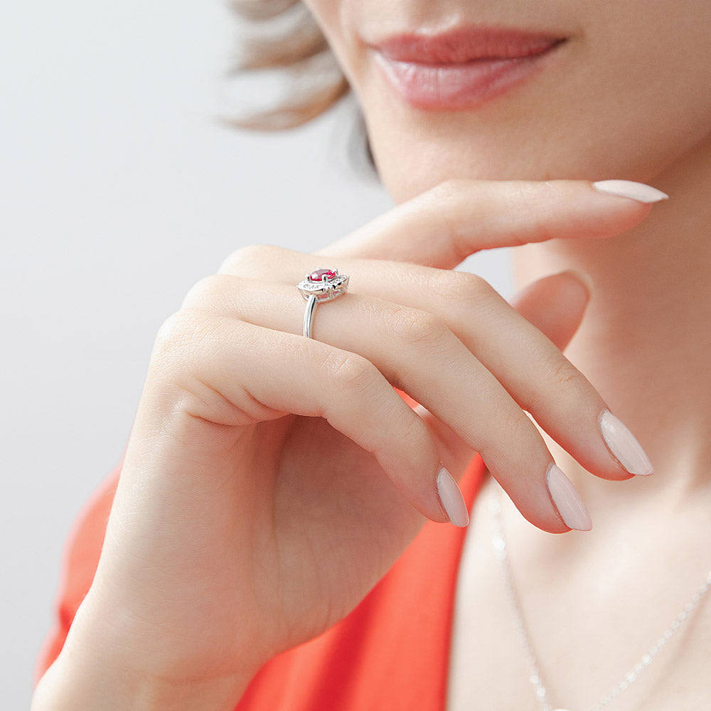 Model wearing Halo Flower Ruby-Red CZ Ring in Sterling Silver, 6 of 11