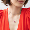 Model wearing Flower Halo CZ Necklace in Sterling Silver, Ruby Color