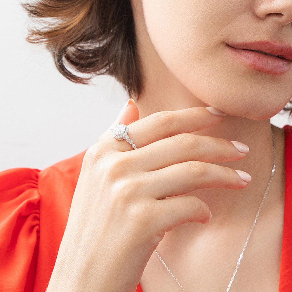 Model wearing Halo Flower Round CZ Ring in Sterling Silver, 7 of 12
