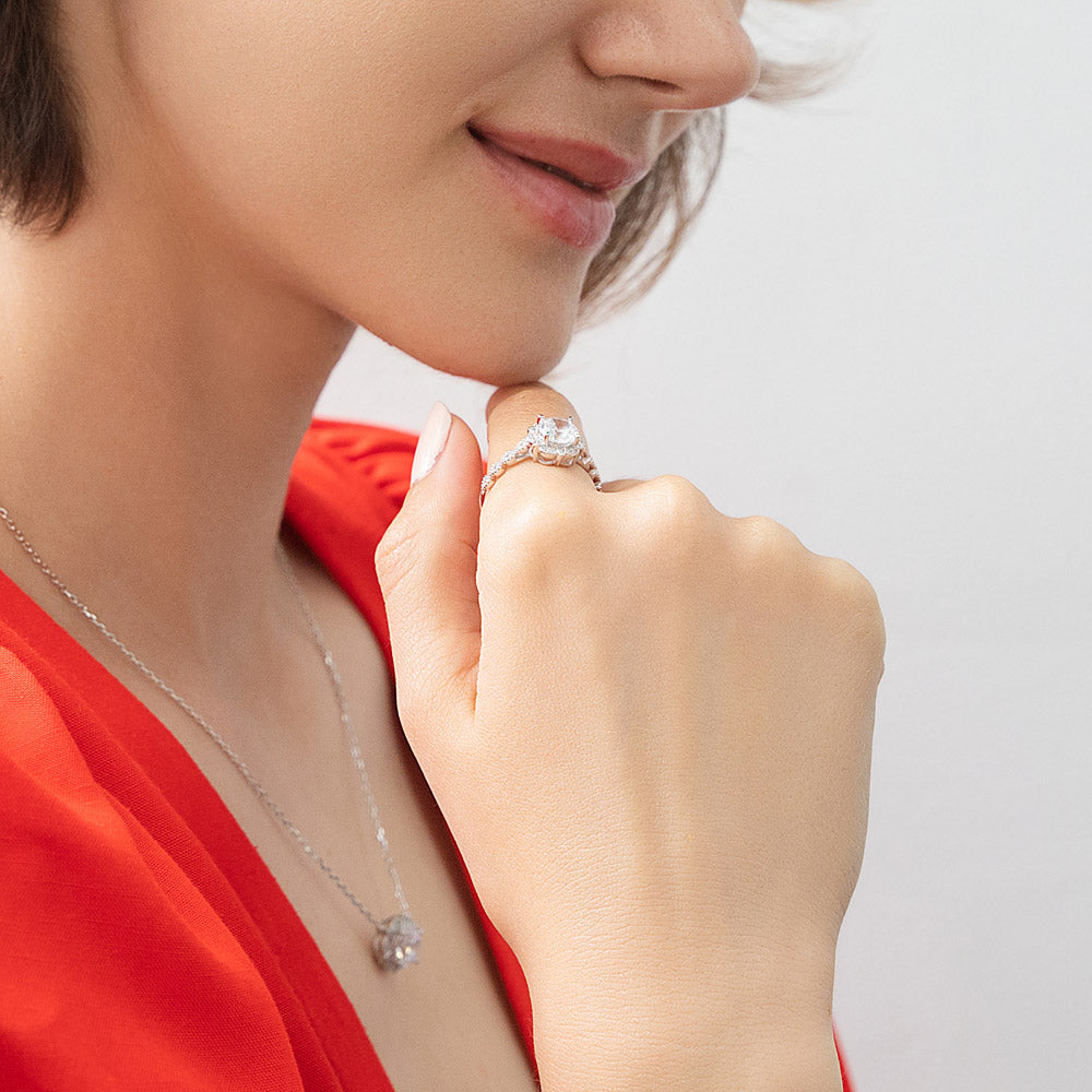 Model wearing Halo Flower Round CZ Ring in Sterling Silver, 6 of 12
