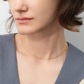 Model wearing Adjustable Slider Rolo Chain Necklace in Sterling Silver, Yellow Gold Flashed