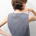 Model wearing Adjustable Slider Rolo Chain Necklace in Sterling Silver, Yellow Gold Flashed