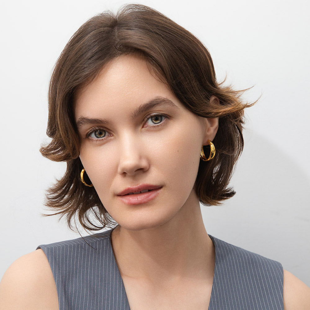 Model wearing Dome Hoop Earrings in Sterling Silver, 2 Pairs, Yellow Gold Flashed