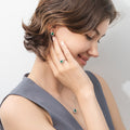 Model wearing Flower Halo CZ Necklace in Sterling Silver, Emerald Color