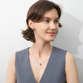 Model wearing Flower Halo CZ Necklace in Sterling Silver, Emerald Color