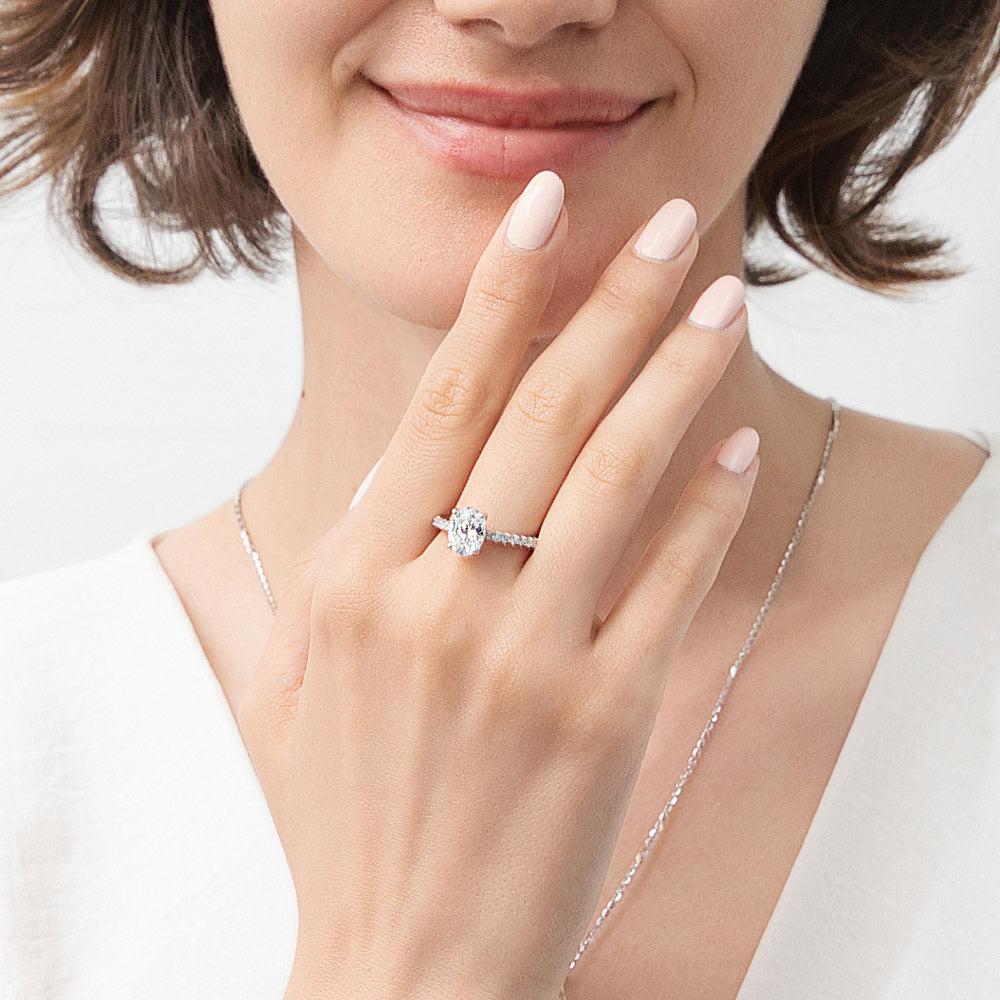 Model wearing Solitaire 1.8ct Oval CZ Ring in Sterling Silver, 6 of 11