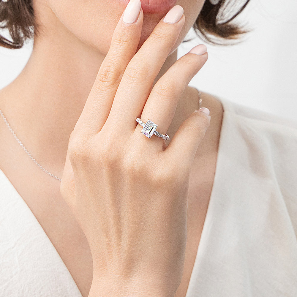 Model wearing Solitaire 1.7ct Step Emerald Cut CZ Ring Set in Sterling Silver, 9 of 12
