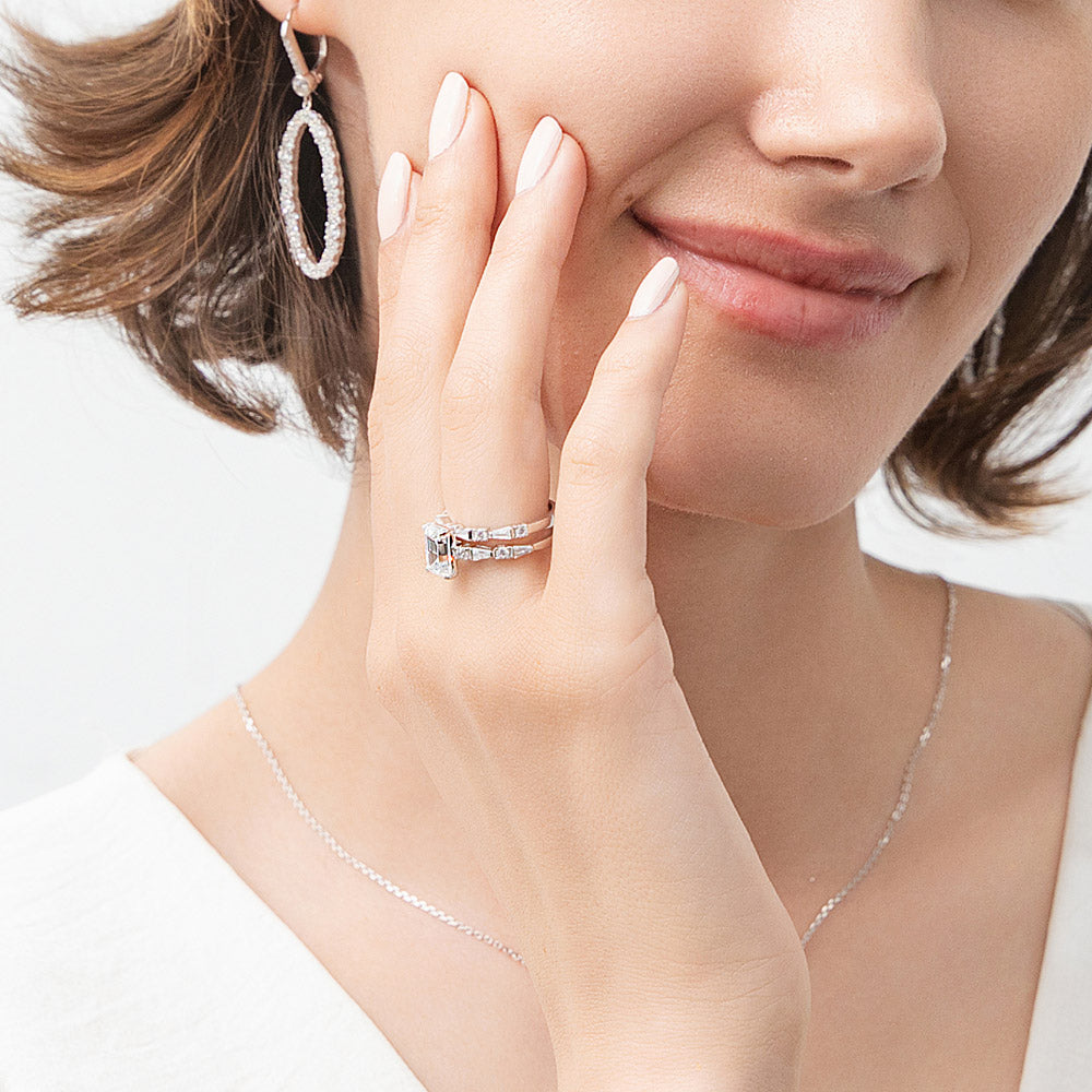 Model wearing Solitaire Art Deco Emerald Cut CZ Ring Set in Sterling Silver, 7 of 12