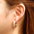 Model wearing Dome CZ Medium Hoop Earrings 0.78 inch, Gold-Tone