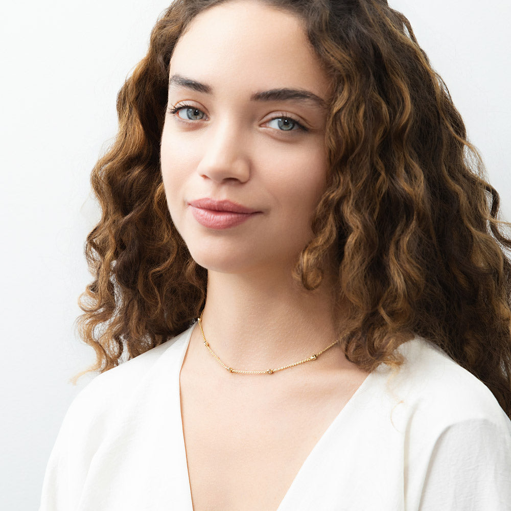 Model wearing Station CZ Station Necklace in Sterling Silver, Yellow Gold Flashed / 16 inch + 2 inch extension