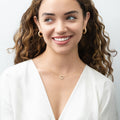 Model wearing Open Heart CZ Necklace in Sterling Silver, Yellow Gold Flashed