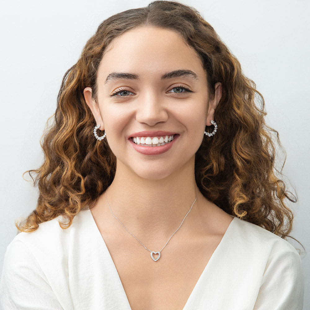 Model Wearing Cluster Hoop Earrings, Open Heart Pendant Necklace