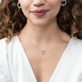 Model wearing Open Heart CZ Necklace in Sterling Silver, Yellow Gold Flashed