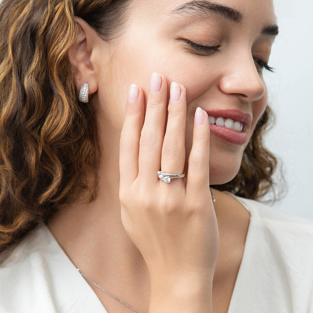 Model wearing Dome CZ Small Huggie Earrings in Sterling Silver 0.6 inch, Rhodium Plated, Cubic Zirconia