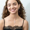 Model wearing Halo Clover Oval CZ Necklace in Sterling Silver, Clear Color