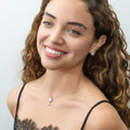 Model wearing Key and Lock CZ Stud Earrings in Sterling Silver, Clear Color