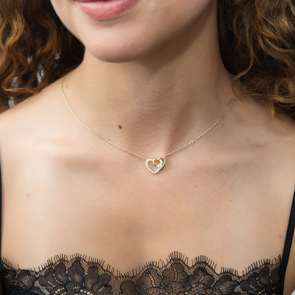 Model wearing Open Heart CZ Necklace in Sterling Silver, Rose Gold Flashed