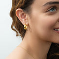Model wearing Dome Small Hoop Earrings in Sterling Silver 0.8 inch, Yellow Gold Flashed