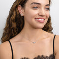 Model wearing Bow Tie Ribbon CZ Stud Earrings in Sterling Silver, Style 2