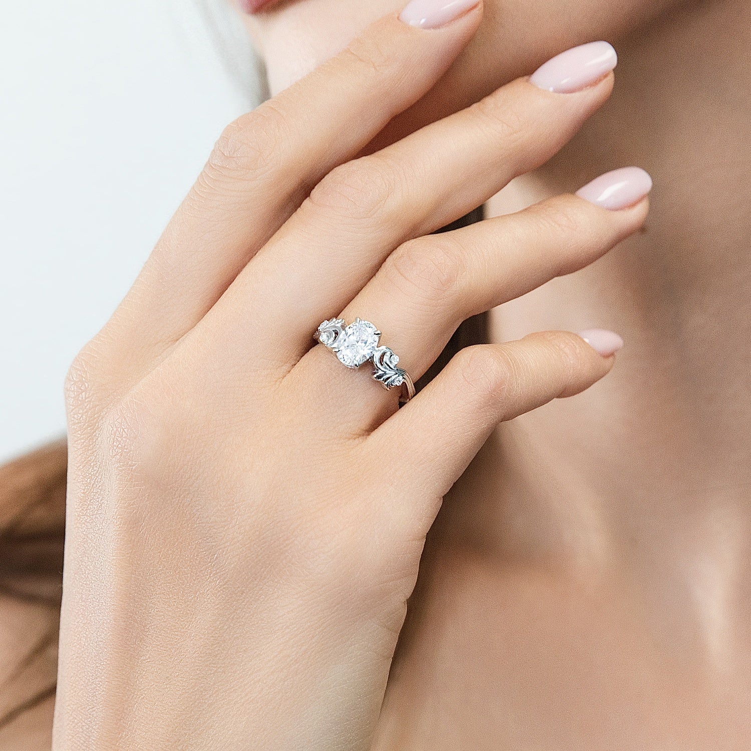 Model wearing Solitaire Filigree Flower 1.2ct Oval CZ Ring in Sterling Silver, 2 of 11