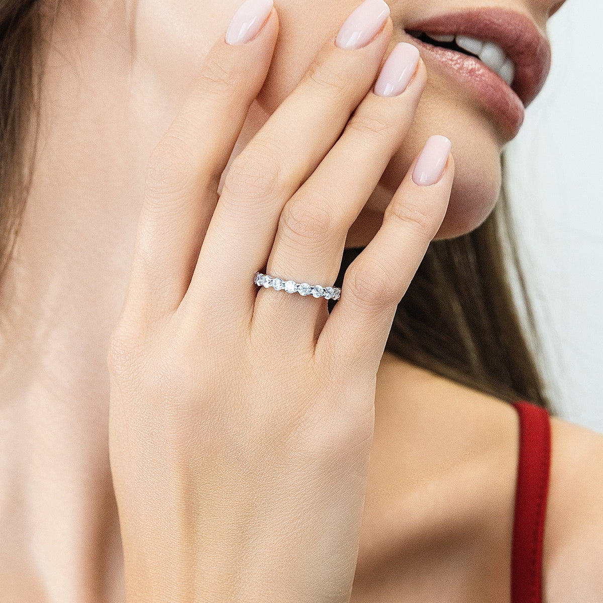 Model wearing Pave CZ Eternity Ring in Sterling Silver, 2 of 9