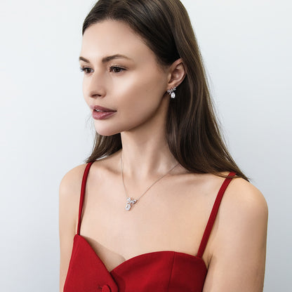 Model Wearing Bow Tie Necklace Style N1746-01, Ribbon Dangle Earrings Style E1909-01