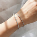 Model wearing Flexible CZ Bangle in Sterling Silver, 1.75mm / 6.5 inch