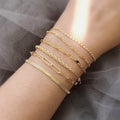 Model wearing Twisted Rope Chain Bracelet in Sterling Silver 3mm, Yellow Gold Flashed