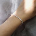 Model wearing Chain Bracelet in Sterling Silver 3mm, Yellow Gold Flashed