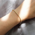 Model wearing Twisted Rope Chain Bracelet in Sterling Silver 3mm, Yellow Gold Flashed
