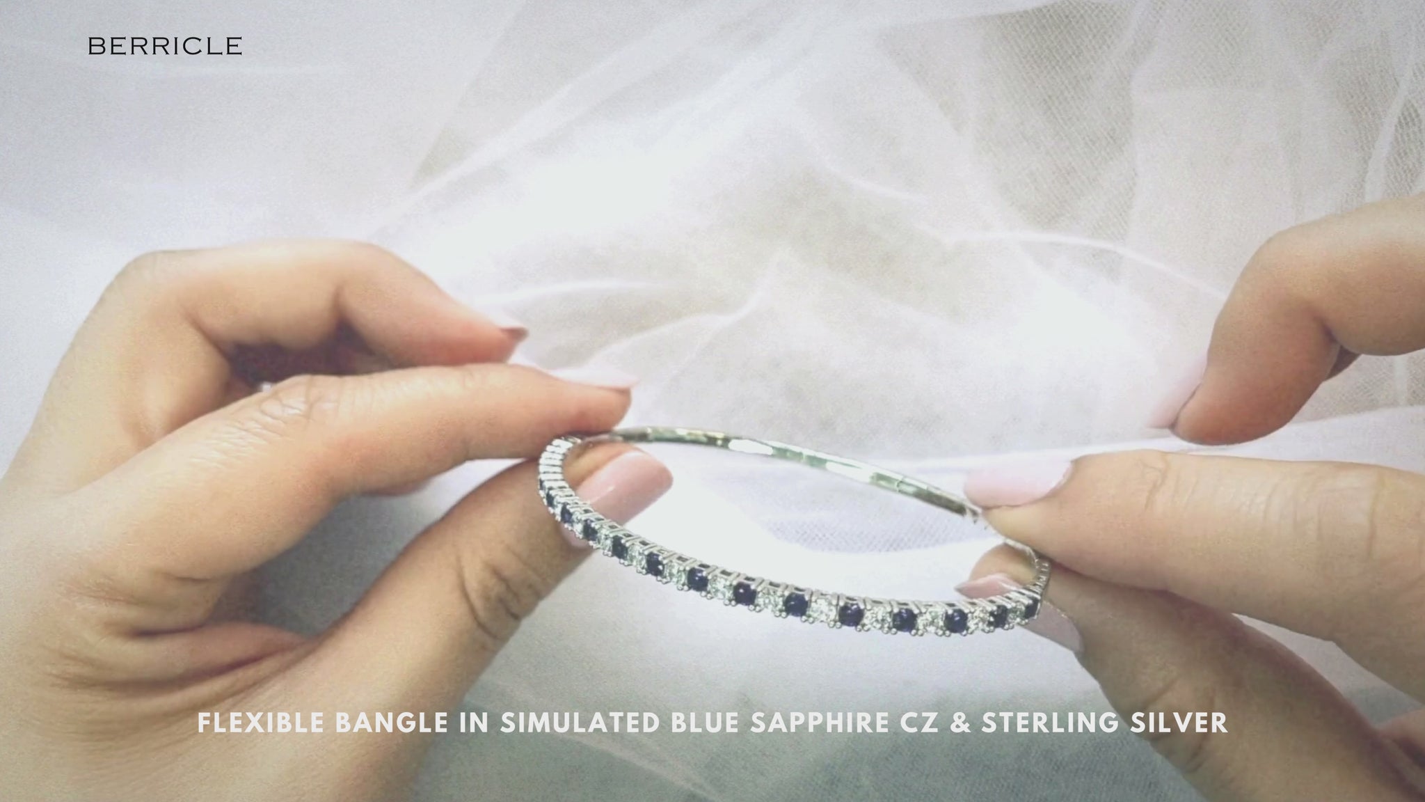 Video Contains Flexible Simulated Blue Sapphire CZ Bangle in Sterling Silver. Style Number B403