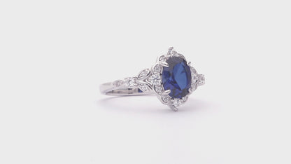Video Contains Halo Simulated Blue Sapphire Oval CZ Ring Set in Sterling Silver. Style Number VR628-04